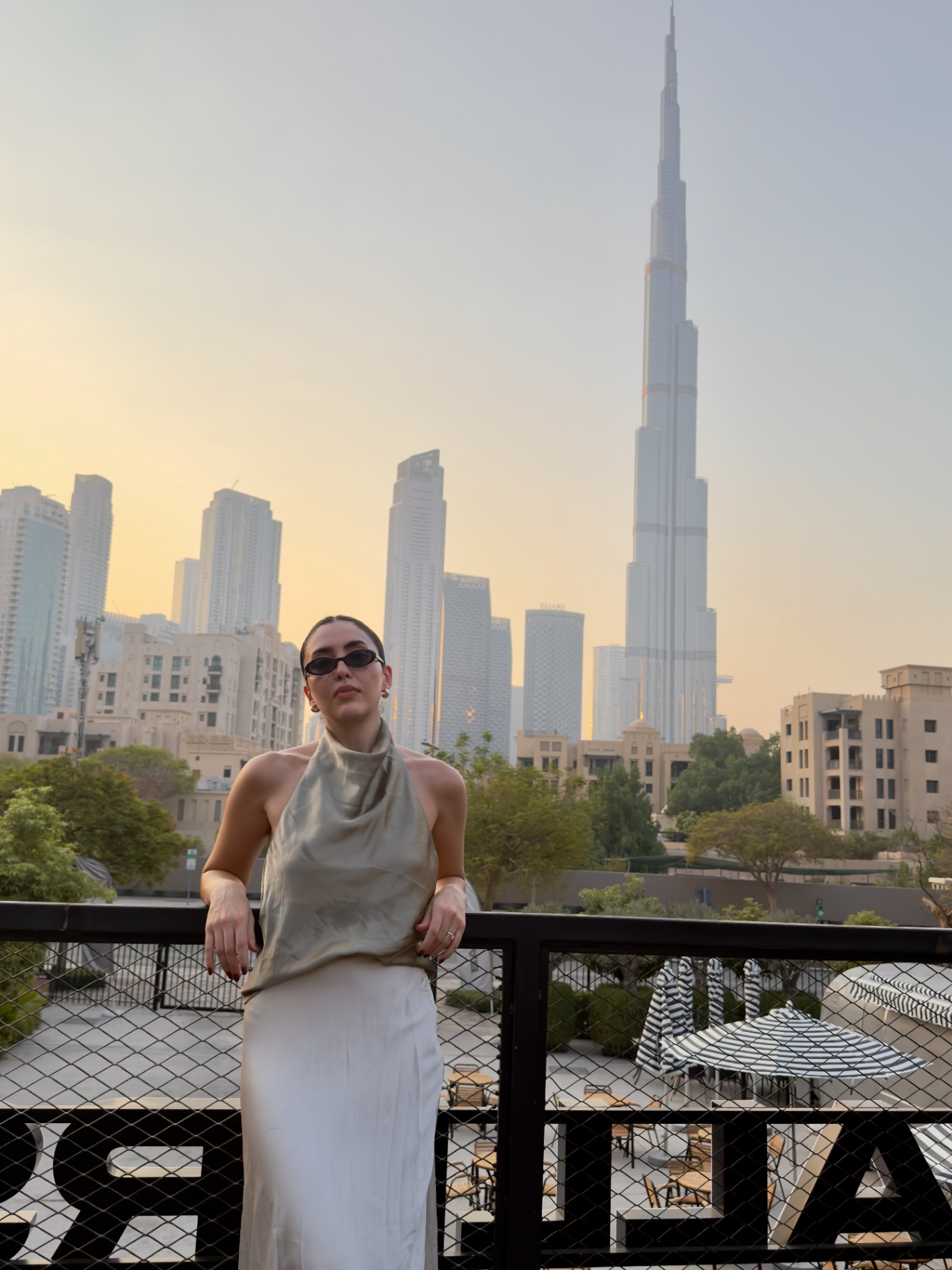 Guest at golden hour with the Burj Khalifa in the distance